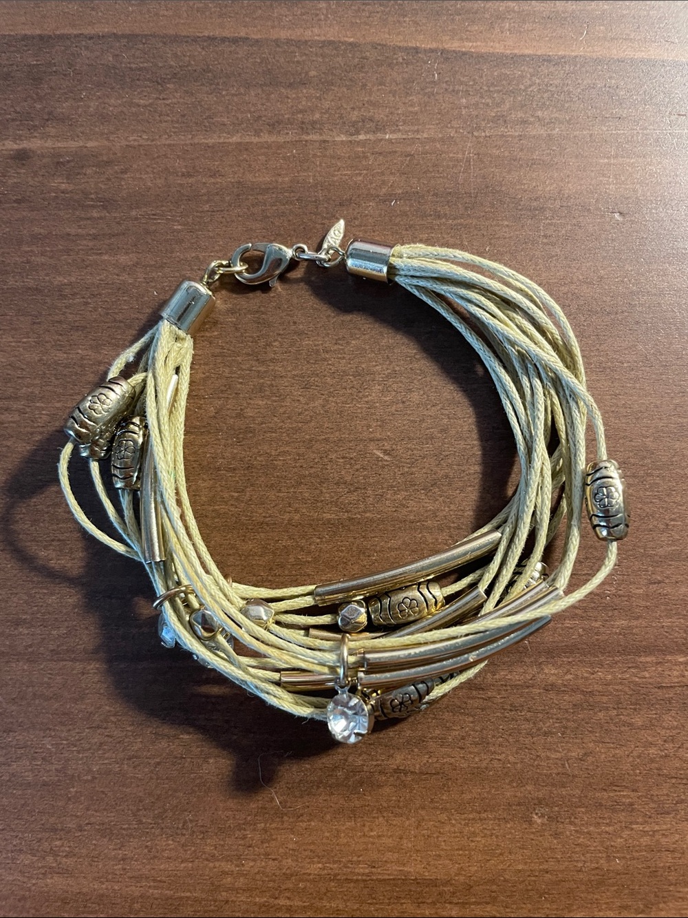 SAQ Multi-Strand Beige Cord Bracelet with Gold Beads and Crystal Charm